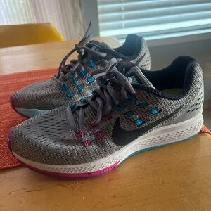 Nike Women's Gray Running Shoes with Pink and Blue Accents